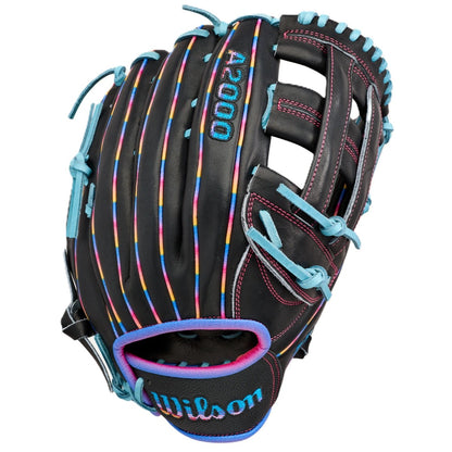 The Wilson Love the Moment A2000 1750 12.5" Baseball Glove (WBW104831125) features a black design with colorful vertical stripes, light blue laces, blue and pink accents, and the Wilson logo stitched in blue on the wrist strap.