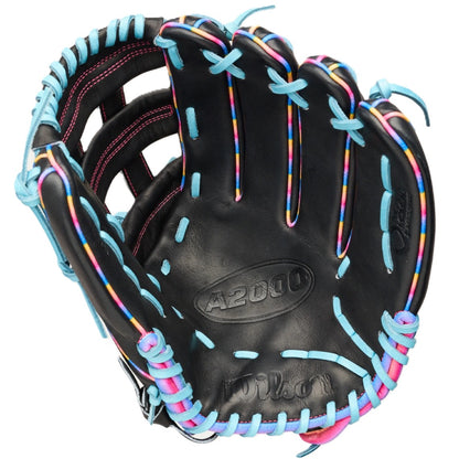 The Wilson Love the Moment A2000 1750 12.5" Baseball Glove (WBW104831125) features a black design with light blue laces, multicolor finger accents, and pink thumb stitching—a striking outfield glove for 2026.