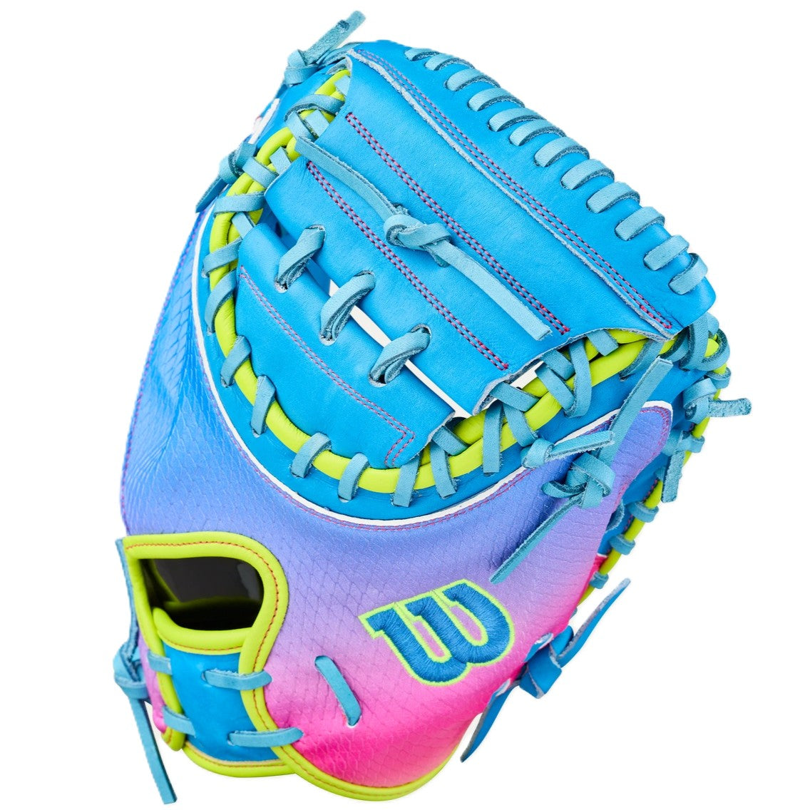 The Wilson Love the Moment A2000 CM33SS 33" Catcher’s Mitt features a vibrant blue, pink, and yellow gradient with blue laces, a “W” logo near the thumb, and is crafted from durable Pro Stock Leather.