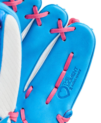 A close-up of the Wilson Love the Moment A2000 H12SS 12" Fastpitch Glove shows its bright blue color with pink laces, a white accent, and an embossed heart logo plus THE MOMENT and #A10MOMENT SPEAKS on the palm to honor Autism Speaks.