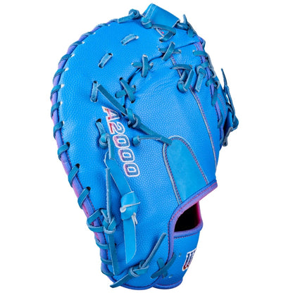 The Wilson Love the Moment A2000 1612 12" First Base Mitt (WBW10483812) features bright blue Pro Stock Leather with purple stitching and accents, Autism Speaks details, and A2000 branding, shown on a white background.