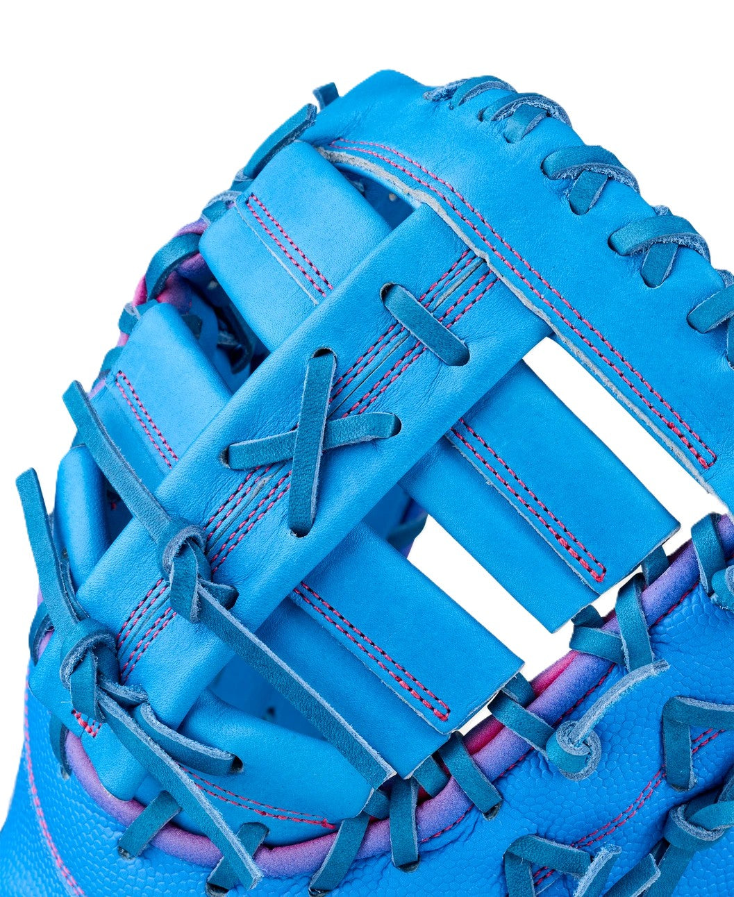 Close-up of the Wilson Love the Moment A2000 1612 12" First Base Mitt, featuring bright blue Pro Stock Leather, pink stitching, and blue laces—showcasing Wilson’s detailed craftsmanship and premium texture.