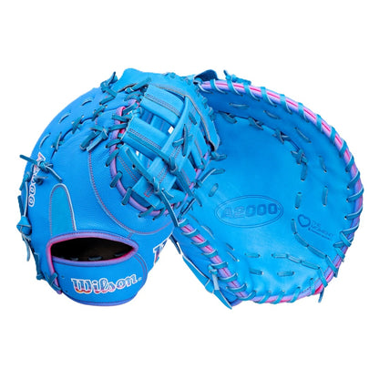The Wilson Love the Moment A2000 1612 12" First Base Mitt features Pro Stock Leather in bright blue with pink and blue lacing, a padded pocket, and visible Wilson branding. Shown from front and back.