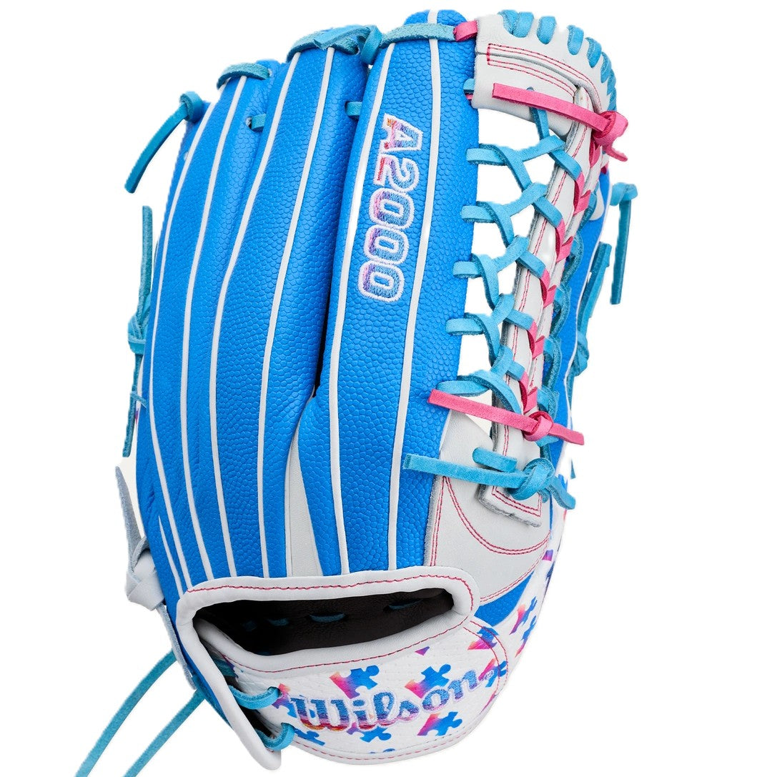 The Wilson Love the Moment A2000 T125SS 12.5" Fastpitch Glove (WBW104839125) features blue, white, and pink colors, blue lacing, “A2000” stitched on the back, and Autism Speaks puzzle piece accents on the wrist.