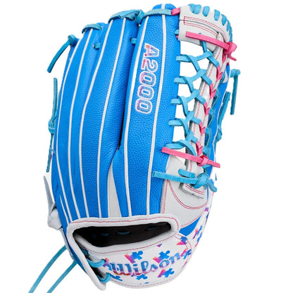 The Wilson Love the Moment A2000 T125SS 12.5" Fastpitch Glove (WBW104839125) features blue, white, and pink colors, blue lacing, “A2000” stitched on the back, and Autism Speaks puzzle piece accents on the wrist.