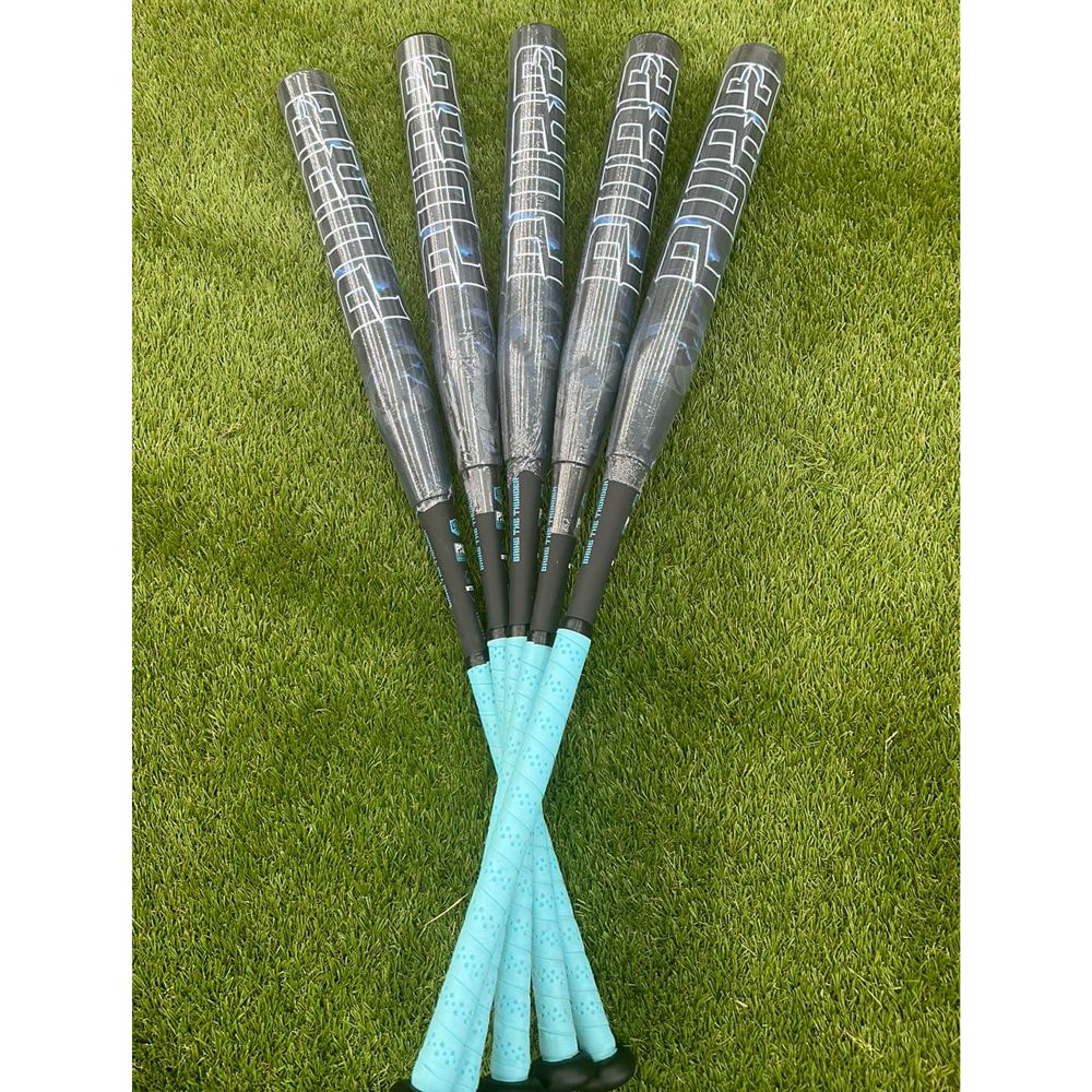 Five black Pure Sports composite bats with turquoise handles, including the 2025 Pure Storm Shadow 13″ Balanced USA Slowpitch Softball Bat (5147M91B), are arranged in a fan shape on green artificial turf.