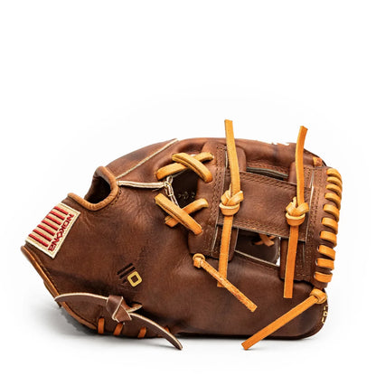 Handcrafted brown leather Nokona Walnut EP 11.5″ Baseball Glove: W-EP1150 featuring tan lacing and a rectangular American flag patch on the wrist strap.
