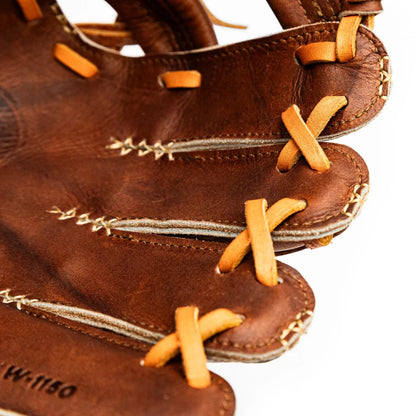 Close-up of a handcrafted Nokona Walnut EP 11.5″ Baseball Glove: W-EP1150 showing the finger stalls laced with tan leather cords.