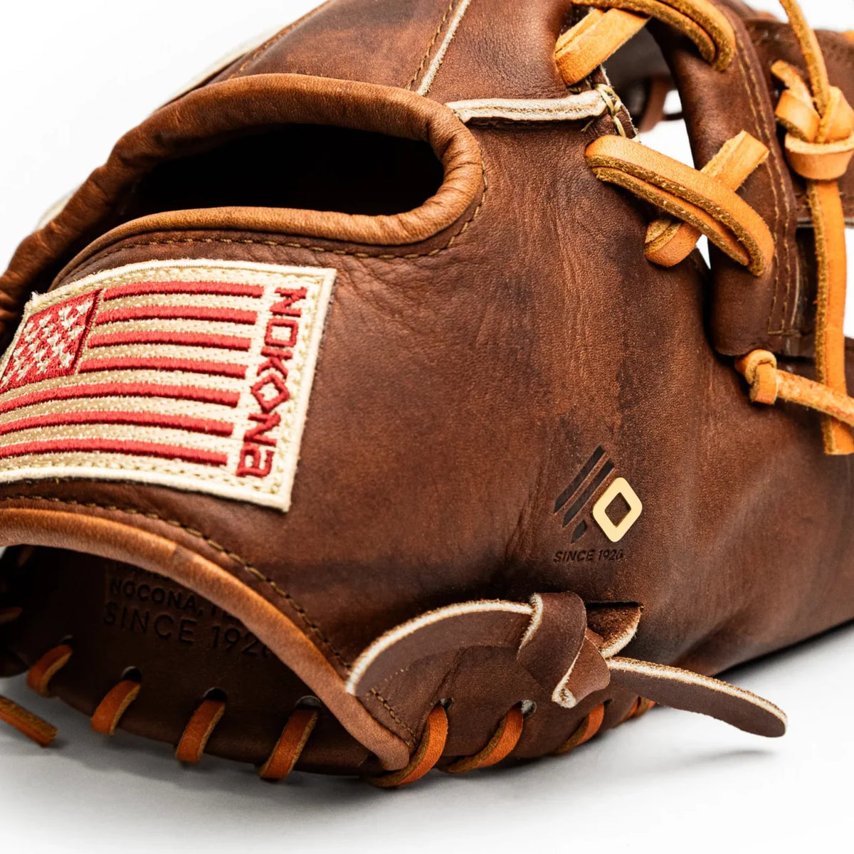 Nokona Walnut EP 11.5″ Baseball Glove: W-EP1150 in brown leather, featuring a stitched American flag patch and a small logo on the side.