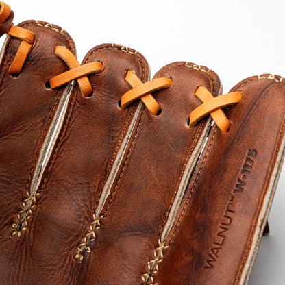 Close-up of a brown leather Nokona Walnut EP 11.75″ Baseball Glove: W-EP1175 with tan laces, showing the fingers and the stamped text WALNUT W-1175 on the handcrafted baseball glove.