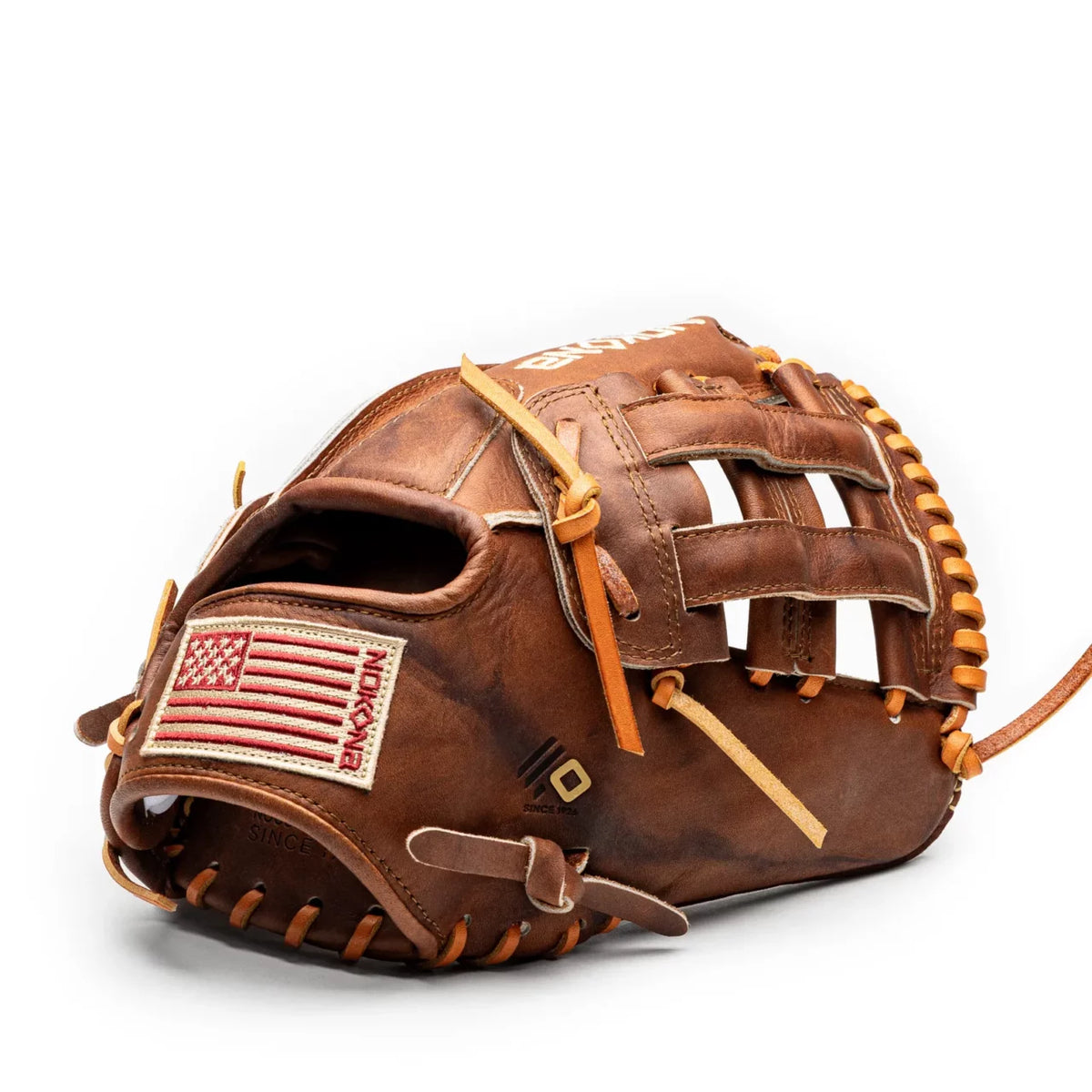 Handcrafted brown leather Nokona Walnut EP 11.75″ Baseball Glove: W-EP1175 with a red, white, and blue American flag patch on the wrist strap.