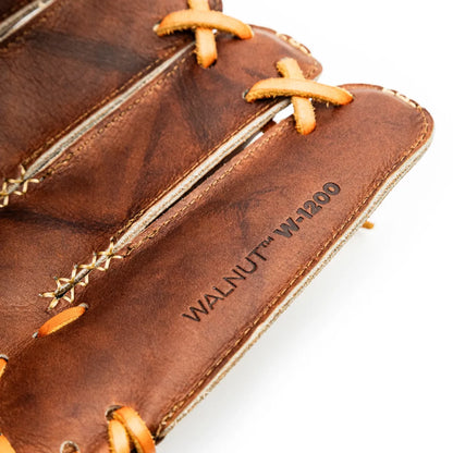 Close-up of a handcrafted Walnut Crunch Nokona Walnut EP 12″ Baseball Glove: W-EP1200 with tan lacing, stamped with the text WALNUT W-1200.