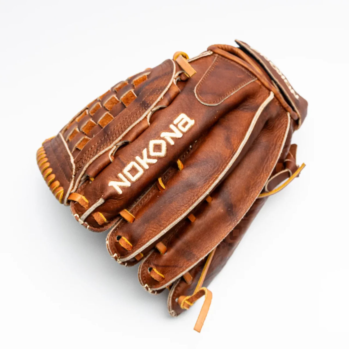 Nokona Walnut EP 12.5″ Fastpitch Glove: W-EP-V1250, a handcrafted Walnut Crunch leather fastpitch glove featuring a basket weave web and white embroidered lettering.