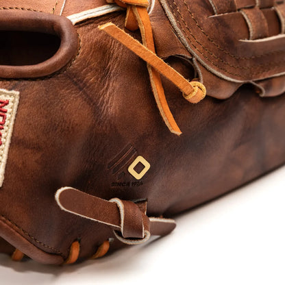 Close-up of a brown Walnut Crunch Nokona Walnut EP 13″ Baseball Glove: W-EP1300C showing the back of the shell, a woven leather web, and a small square logo detail.