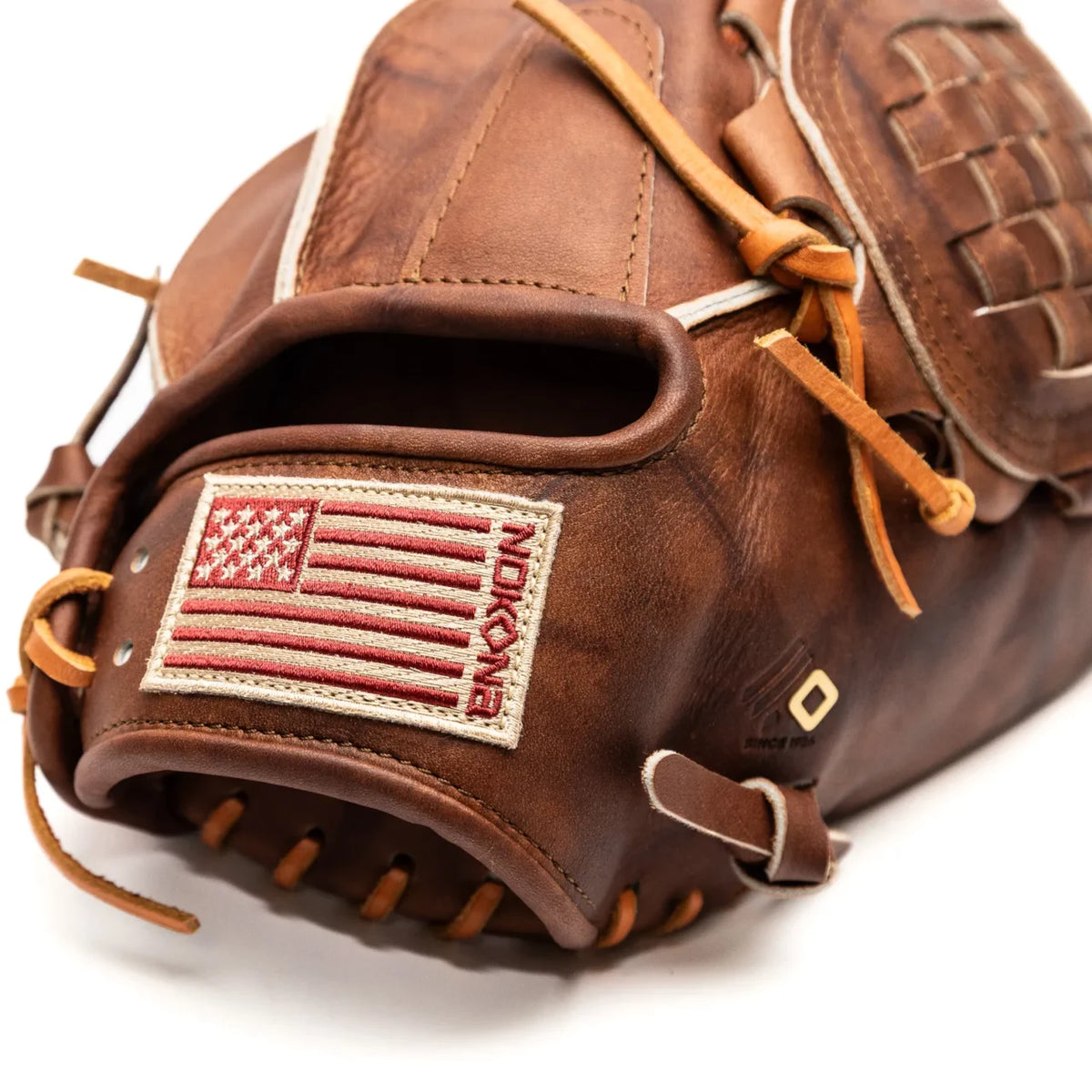 Brown Nokona Walnut EP 13″ Baseball Glove: W-EP1300C made of Walnut Crunch leather, featuring an American flag patch and the brand name on the wrist strap.