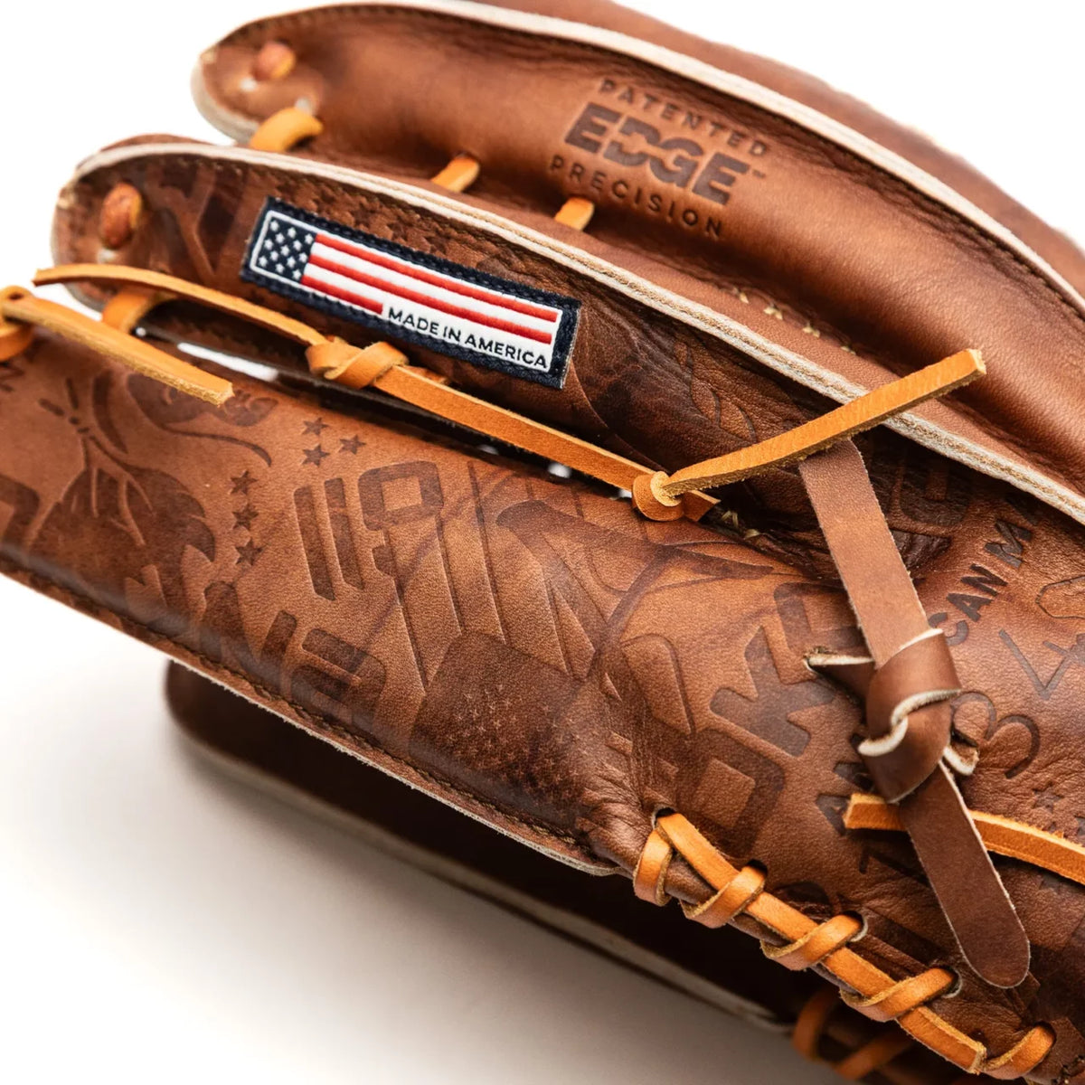 Close-up of a Nokona Walnut EP 13″ Baseball Glove: W-EP1300C, featuring brown Walnut Crunch Leather with a patterned surface, tan laces, and a Made in America label with an American flag.