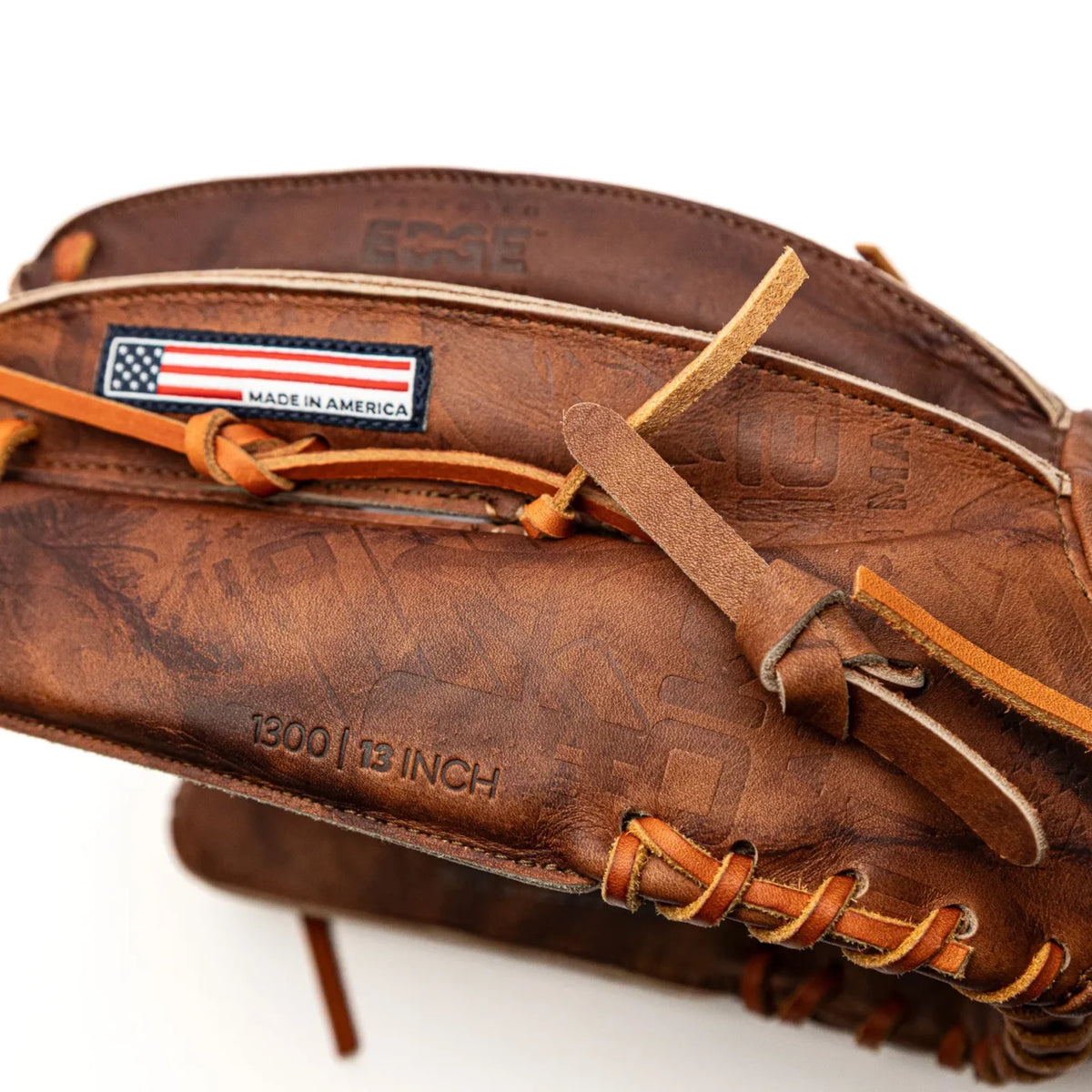 A brown leather Nokona Walnut EP 13″ Baseball Glove: W-EP1300H with a Made in America flag patch and the text 1300 | 13 INCH embossed on the thumb.