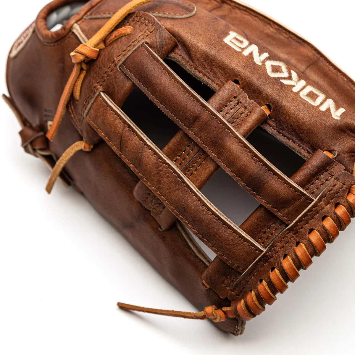 Brown leather Nokona Walnut EP 13″ Baseball Glove: W-EP1300H with an H-web design and tan lacing.