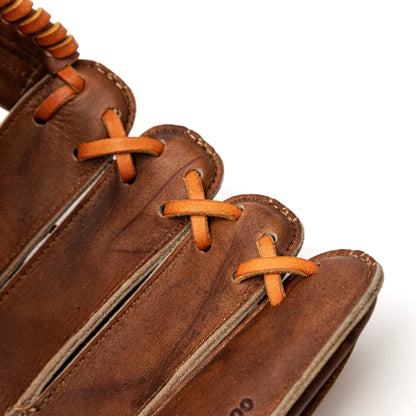 Close-up view of the fingers of a brown leather Nokona Walnut EP 13″ Baseball Glove: W-EP1300H with tan lacing.