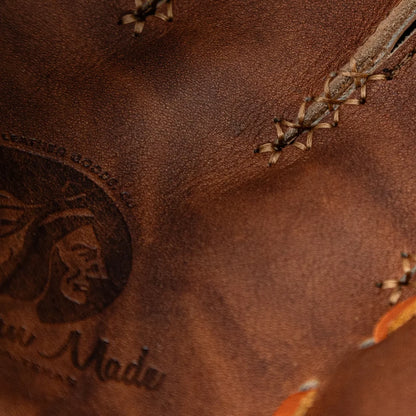 Close-up of a Nokona Walnut EP 13″ Baseball Glove: W-EP1300H showing heavy-duty cross-stitching and an embossed logo.