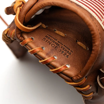 A brown Nokona Walnut EP 13″ Baseball Glove: W-EP1300H featuring a stamp reading Crafted with pride in Nocona, Texas since 1926 and a red and white striped accent.
