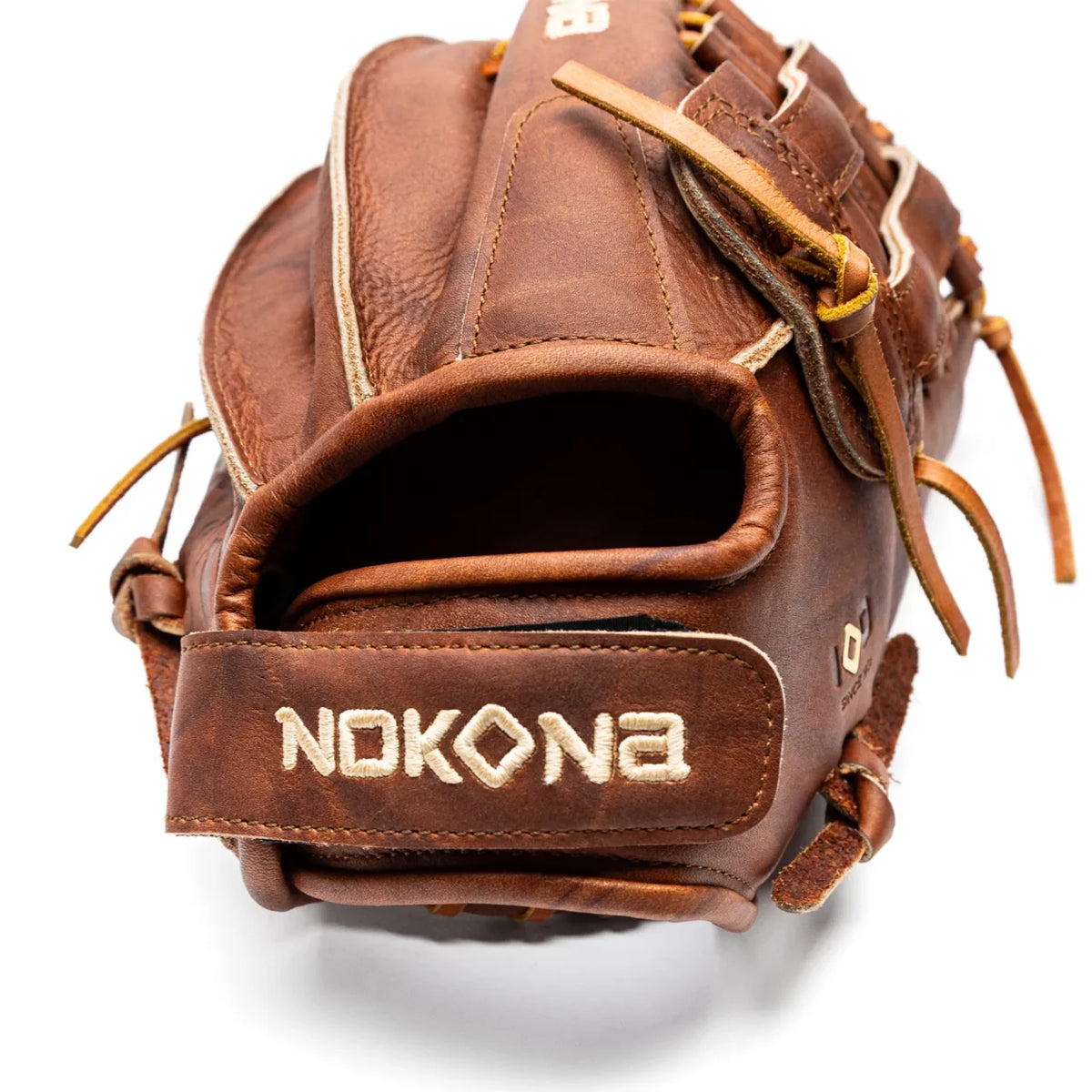 Back view of a 13″ H Web Nokona Walnut EP 13″ Fastpitch Glove (W-EP-V1300H) in Walnut Crunch leather, featuring an adjustable wrist strap with embroidered lettering.