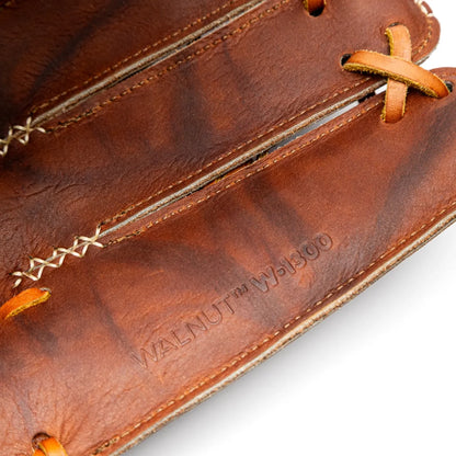 Close-up of a brown leather Nokona Walnut EP 13″ Fastpitch Glove: W-EP-V1300H featuring intricate lacing and the stamped text WALNUT W-1300.