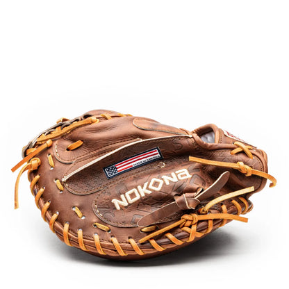 Brown leather Nokona Walnut EP 33.5″ Baseball Catcher’s Mitt: W-EP3350 with tan lacing and a rectangular American flag patch.