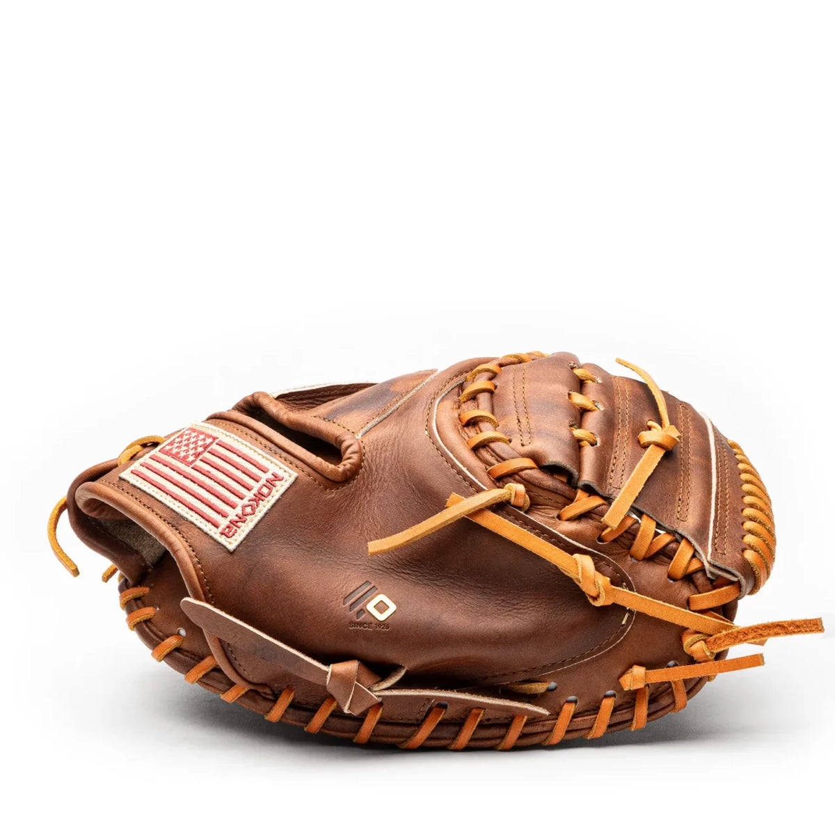 Brown leather Nokona Walnut EP 33.5″ Baseball Catcher’s Mitt: W-EP3350 with tan lacing and an American flag patch.