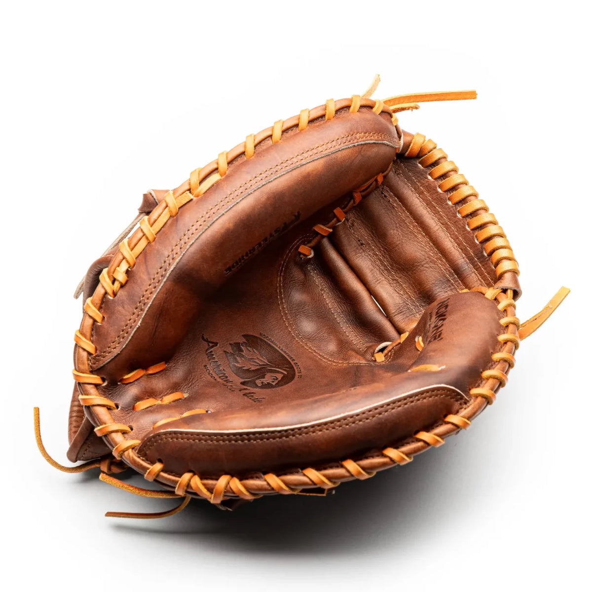 Brown leather Nokona Walnut EP 33.5″ Baseball Catcher’s Mitt: W-EP3350 with tan rawhide lacing.