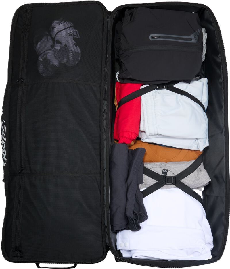 Open black Rawlings Yadi 2 Luggage Wheeled Catcher’s Bag packed with folded athletic clothing and secured with interior compression straps.