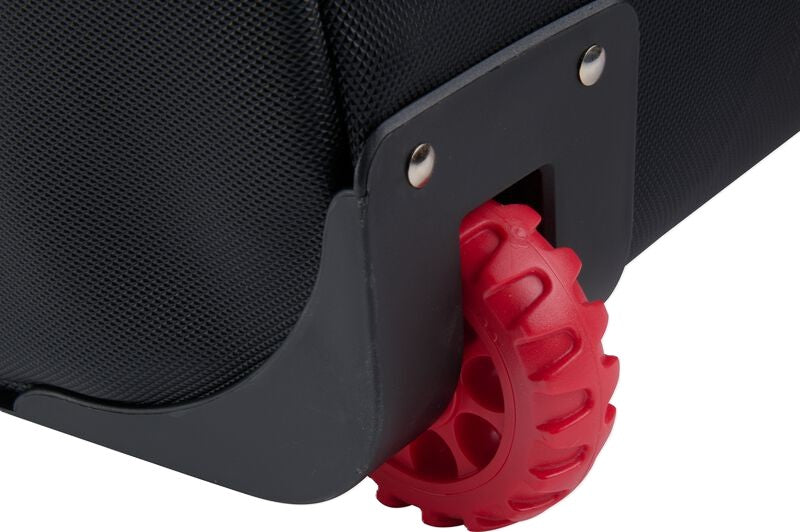 Close-up of a black Rawlings Yadi 2 Luggage Wheeled Catcher’s Bag: YADI2LUGG, featuring a distinctive red lugged wheel.