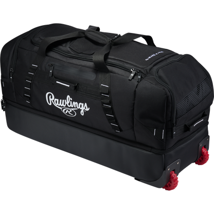 Large black Rawlings Yadi 2 Luggage Wheeled Catcher’s Bag with red wheels and multiple external storage compartments.