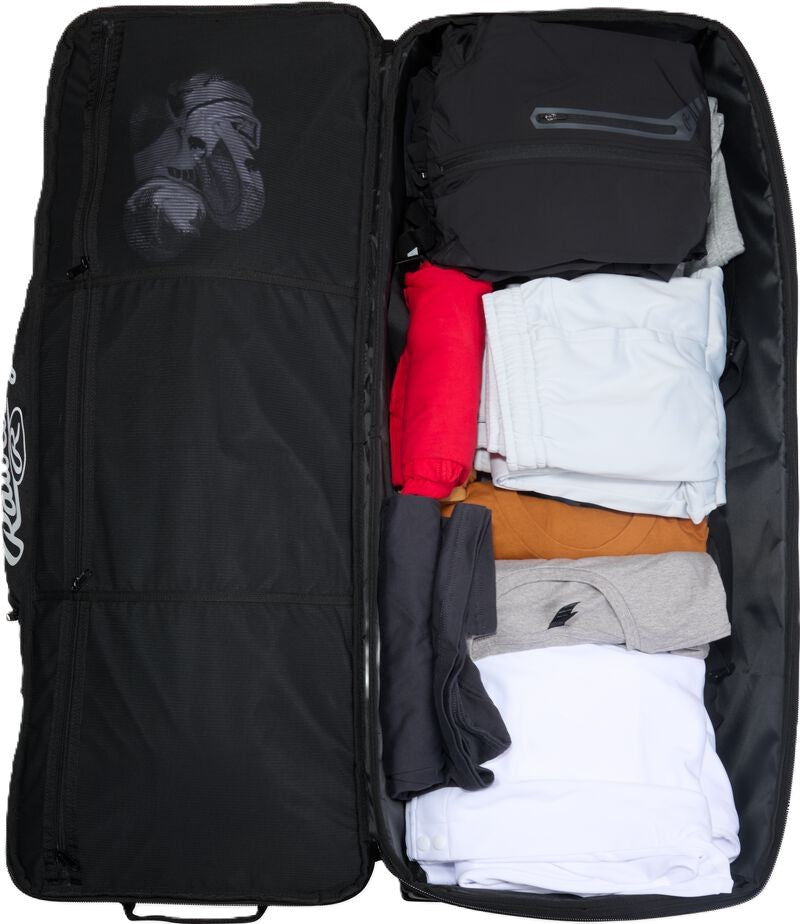 Open, black Rawlings Yadi 2 Luggage Wheeled Catcher’s Bag: YADI2LUGG packed with various folded shirts and pants.