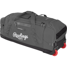 The Rawlings Yadi 2 Wheeled Catcher's Bag (YADI2WHBG) is a large gray equipment bag with black accents, a top handle, multiple zippered compartments, and two red wheels on one end for easy rolling.