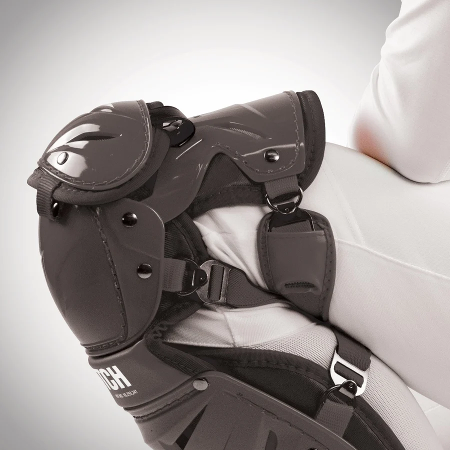 A person wearing All Star AFx Fastpitch Catcher's Leg Guards: LGW-AFX, featuring LINQ™ technology.