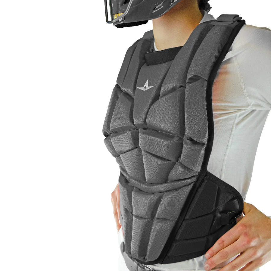 A person wearing the All Star AFx Fastpitch Catcher's Chest Protector (CPW-AFX) over a white long-sleeve shirt, with part of a helmet visible, showcasing contoured fit softball protective gear by All Star.
