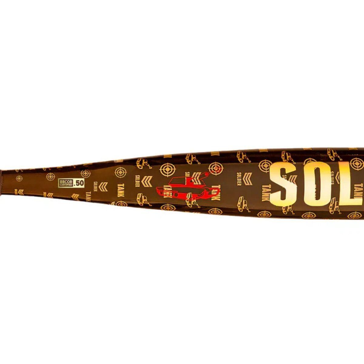 Close-up of a brown and gold Soldier Sports 2026 Soldier Tank 3 (-3) BBCOR Baseball Bat: BB-1-26D, featuring Power Alloy Technology and various small gold logos and designs along the barrel for the largest sweet spot.