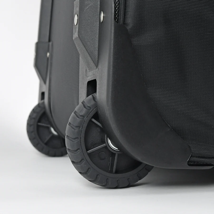 Close-up of two sturdy black wheels on the All Star S7 Elite Catcher's Roller Bag (BB-S7E-RB) featuring textured fabric and reinforced plastic edges, by All Star, set against a plain white background.