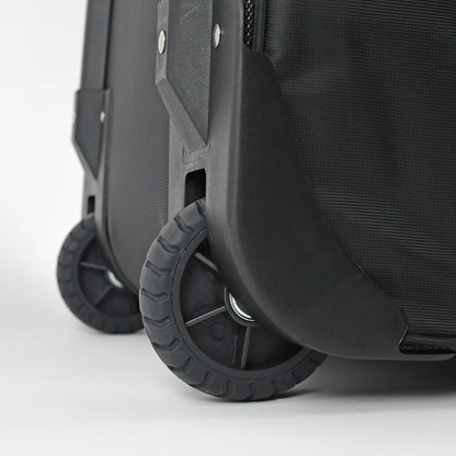 Close-up of two sturdy black wheels on the All Star S7 Elite Catcher's Roller Bag (BB-S7E-RB) featuring textured fabric and reinforced plastic edges, by All Star, set against a plain white background.