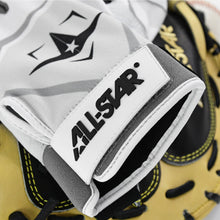 A close-up of the All Star S7 Axis Padded Inner Glove (CG6001) in white, gray, and black, resting on a tan and black leather baseball mitt with yellow stitching.