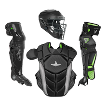 The All Star MVP Pro Catcher's Leg Guards: LG-5 by All Star feature a black and green design with a pivoting hinge system for enhanced one knee down protection, shown with a helmet and chest protector on a plain white background.