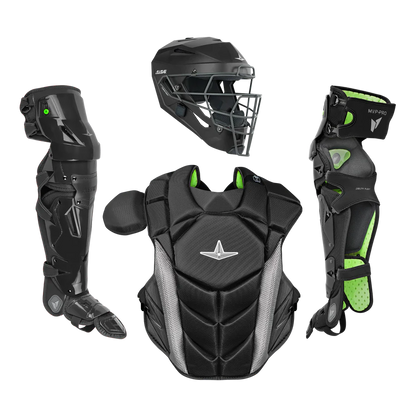 The All Star MVP Pro Catcher's Leg Guards: LG-5 by All Star feature a black and green design with a pivoting hinge system for enhanced one knee down protection, shown with a helmet and chest protector on a plain white background.