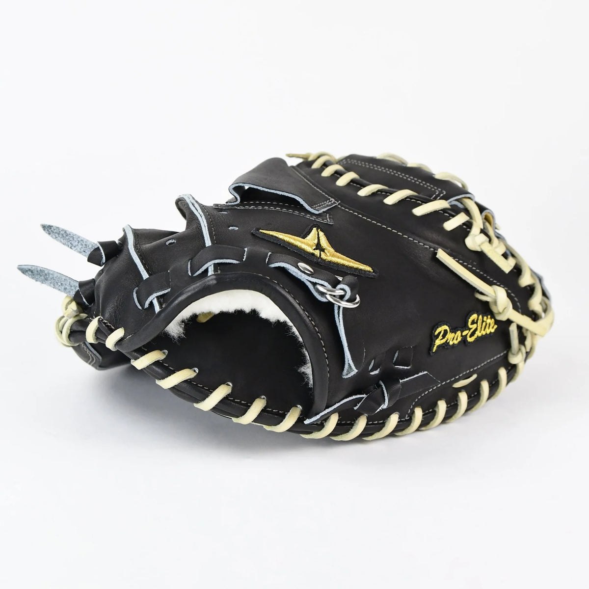 The All Star Pro-Elite Japan 34″ Baseball Catcher’s Mitt: CM3000-J1-34, by All Star, features a striking black and cream design, expertly crafted from premium HIMEJI leather. Highlighted with “Pro-Elite” and a gold logo embroidered on the side, this glove stands out as a premier model in the Japan Series catcher’s mitt lineup. Shown here on a clean white background.
