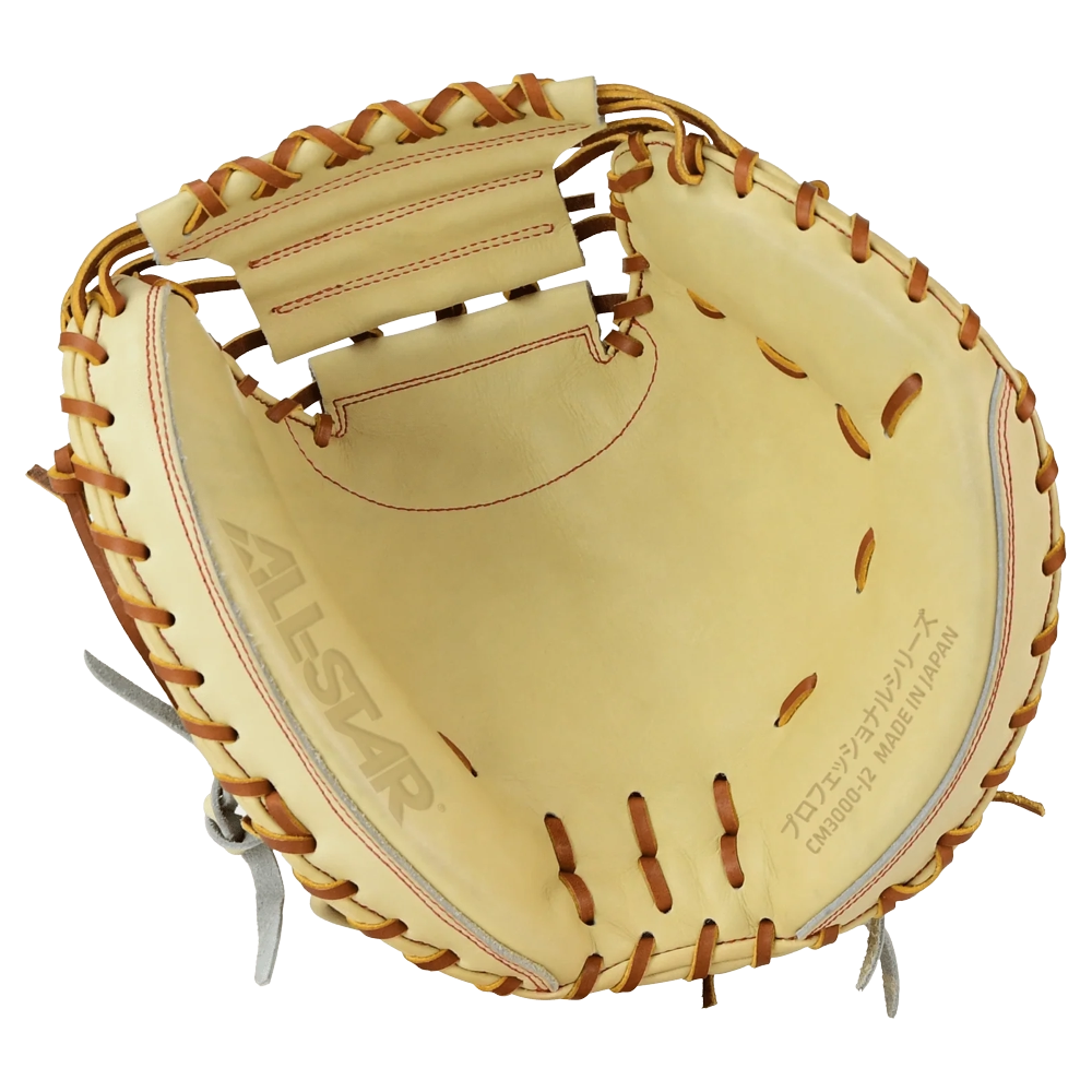 A tan All Star Pro-Elite Japan 34″ Baseball Catcher’s Mitt (CM3000-J2-34), crafted from HIMEJI leather with brown laces, features the ALL STAR logo and Japanese text printed on the palm. The mitt is open, displaying its deep pocket and robust construction.