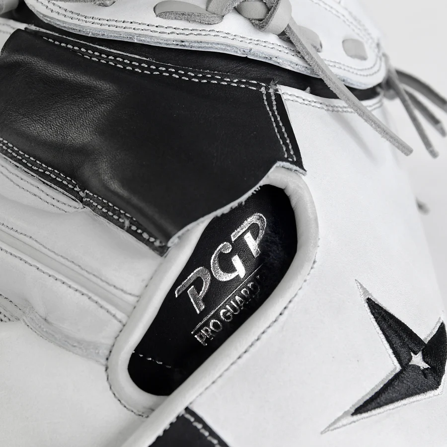 Close-up of a white and black baseball glove featuring the letters PGP and the words Pro Guard embroidered near the thumb area. The glove has visible stitching and laces.