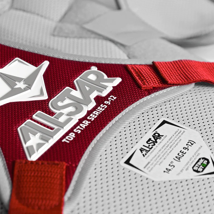 A close-up of the All Star Top Star Catcher's Chest Protector (CPCC-TS), a red and white chest protector by All Star that meets NOCSAE standards—perfect for any travel ball catcher.