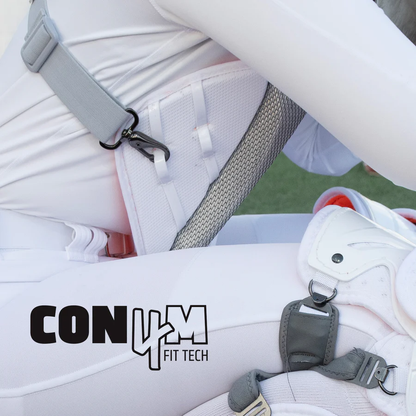 A close-up shows a person in white athletic gear wearing the All Star PHX Paige Halstead Fastpitch Catcher's Chest Protector (CPW-PHX), featuring secure clips and the Con4m Fit Tech logo, endorsed by catcher Paige Halstead.