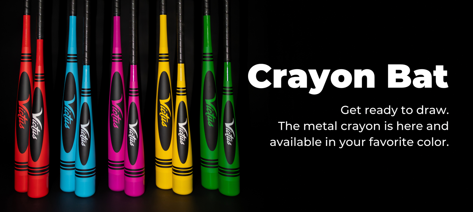 Six metal baseball bats designed to look like crayons in blue, teal, purple, pink, yellow, and green stand upright against a black background. Text beside them advertises “Crayon Bat” in bold white letters.