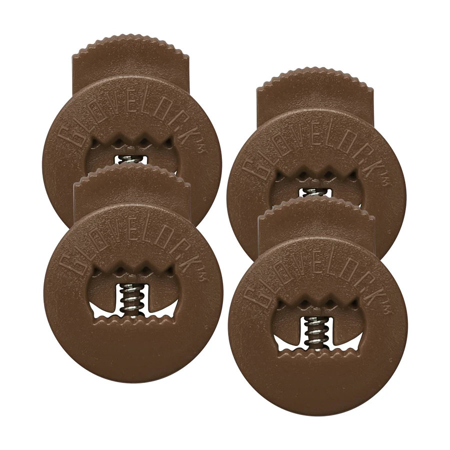 The All Star GloveLock (4 Pack) by All Star includes four brown circular plastic clips with serrated openings, visible metal springs, and "Glovelok" embossed on each. They securely tighten your glove and are arranged in a square like lace lockers.
